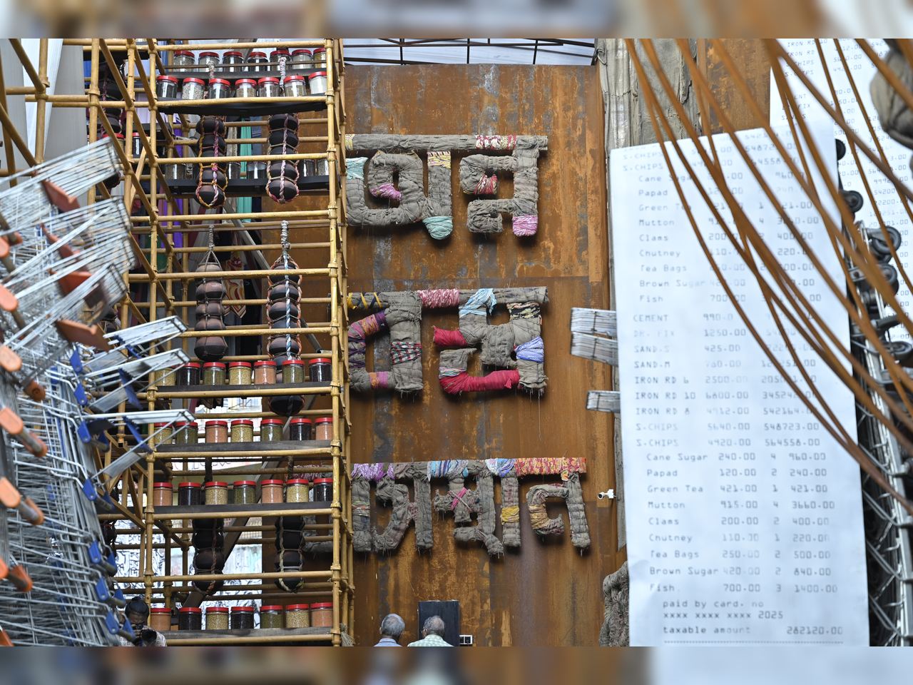 BASIC NECESSITIES: Food, clothing and shelter, the Puja theme, was striking in lettering and presentation